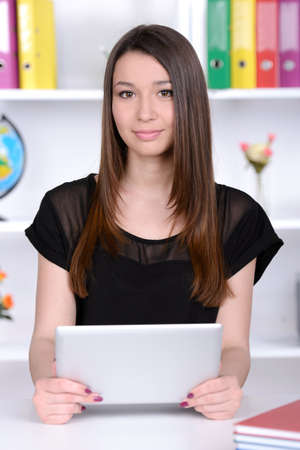 Portrait of a young girl on the  student classroomの写真素材