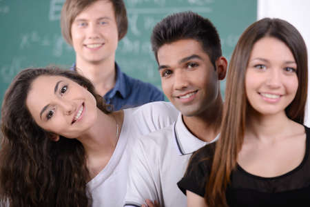 Group young students while studying in classroomの写真素材