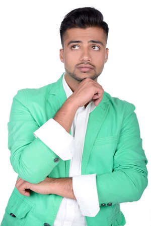 Portrait of an emotional young Indian business man isolated on white の写真素材