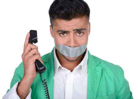 Portrait of an emotional young Indian business man isolated on white の写真素材