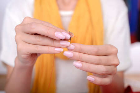 Portrait of a young woman, designer clothing, while working in his officeの写真素材