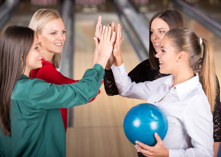 Young group of female friends in bowling alley.の写真素材