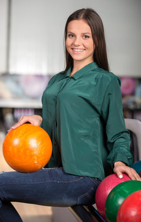 Portrait of a young girl at the colored layers in bowling club.の写真素材