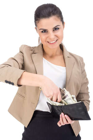 Attractive young woman is holding full of money wallet, isolated on white .の写真素材