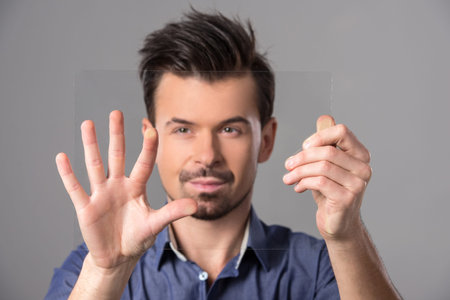 Innovation concept. Man is presenting innovation of his own hands.の写真素材