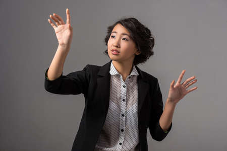 Innovation concept. Young woman is presenting innovation of her own hands.の写真素材