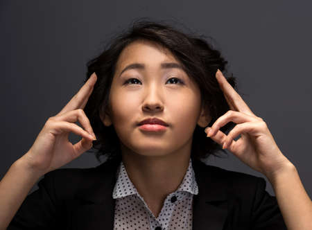 Innovation concept. Young woman is presenting innovation of her own hands.の写真素材