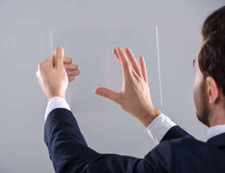 Innovation concept. Young man is presenting innovation of his own hands.の写真素材