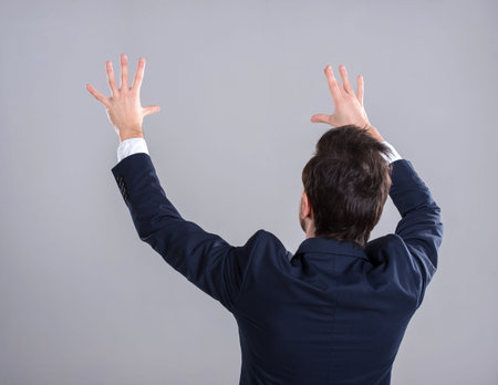 Innovation concept. Young man is presenting innovation of his own hands.の写真素材