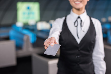 Young business woman is holding a discount card.の写真素材