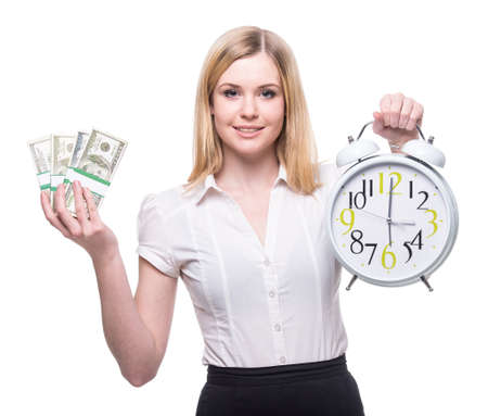 Portrait of young business woman is holding in hands clock and moneyの写真素材