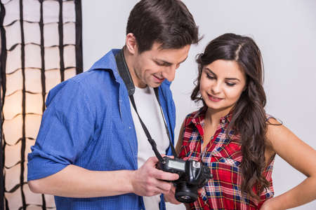Photographer at work with model in the professionally equipped studio.の写真素材