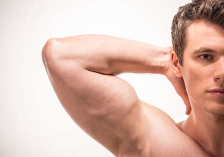 Handsome young man close-up. Isolated on white background.の写真素材