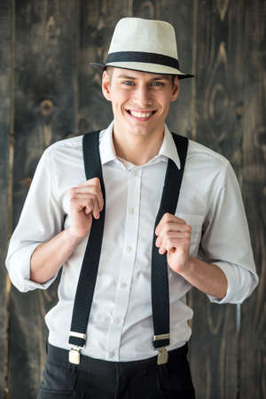 Ganster style. Smilling young handsome man looking at camera.の写真素材