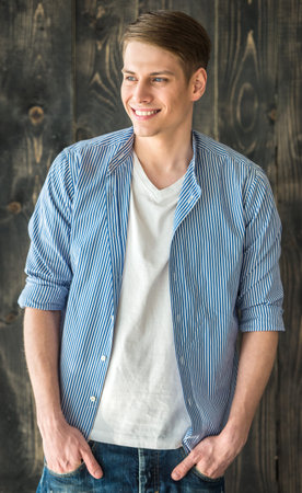 Waist up. Portrait of smilling young handsome man.の写真素材