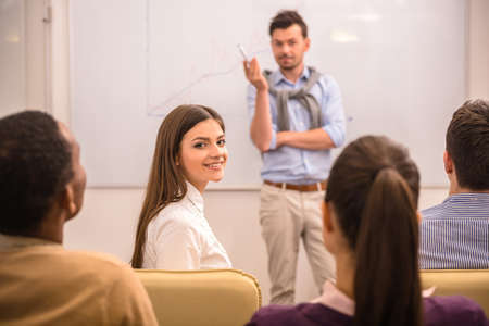 Business meeting. Teamwork concept. Young businessman with speech to colleagues.の写真素材