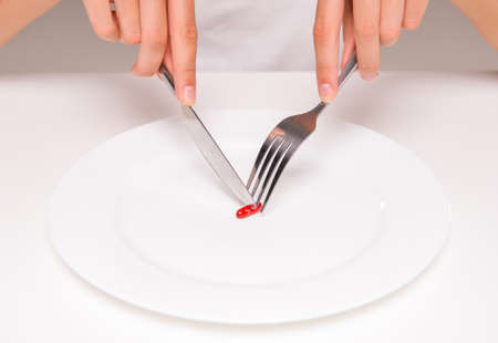 Woman is eating a pill. Concept of healthy food, diet.の写真素材