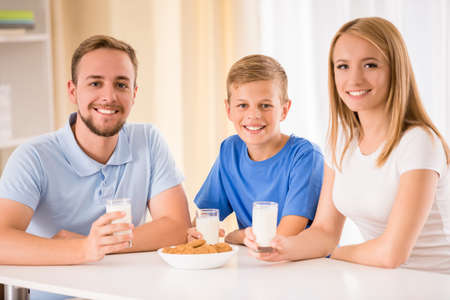 Portrait of happy family while they are having breakfast together.の写真素材