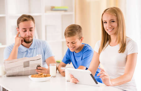 Portrait of happy family while they are having breakfast together.の写真素材