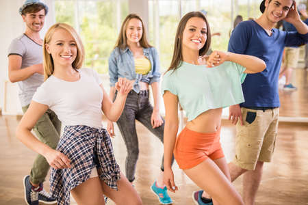 Young dancing people in gym during exercise dancer workout training with happy fresh energy.の写真素材