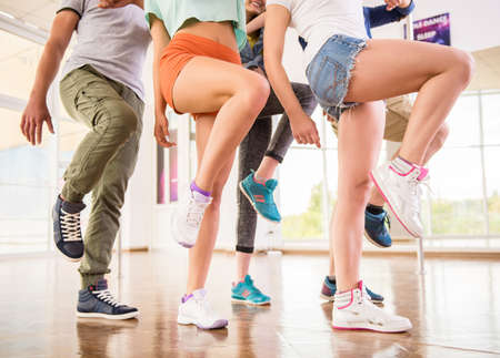 Young dancing people in gym during exercise dancer workout training with happy fresh energy.の写真素材