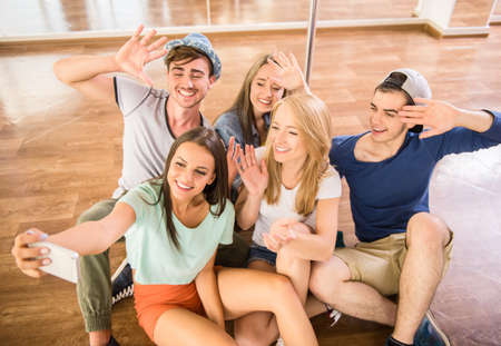 Group of people are making selfie photo in gym or dance studio.の写真素材