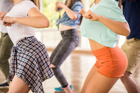 Young dancing people in gym during exercise dancer workout training with happy fresh energy.の写真素材