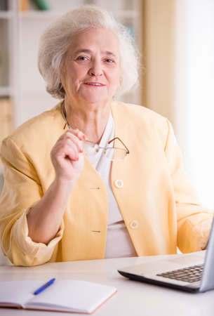 Portrait of Senior business woman working in the officeの写真素材