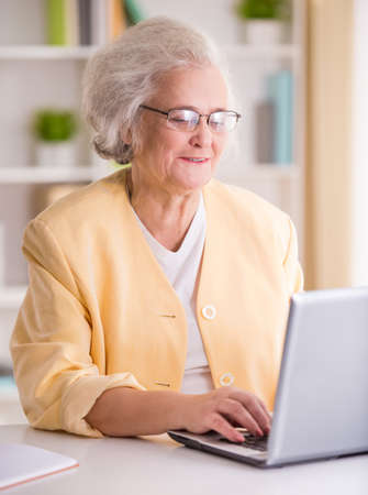 Portrait of Senior business woman working in the officeの写真素材