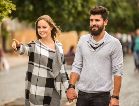 Young happy couple on a walk in the cityの写真素材