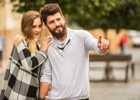 Young happy couple on a walk in the cityの写真素材