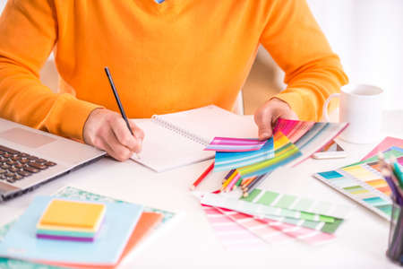 Portrait of a young businessman designer working in officeの写真素材