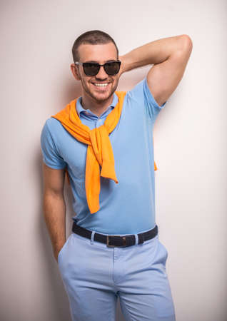 Portrait of fun man on a gray background. Studio shootingの写真素材