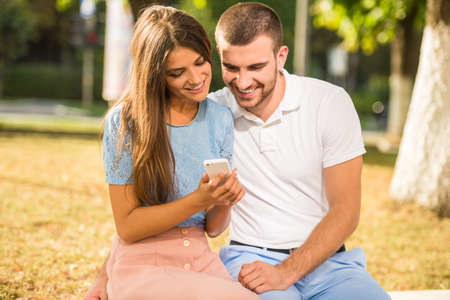 Loving young couple on a date in the parkの写真素材