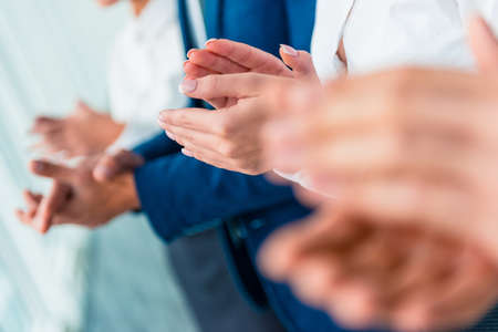 Hands close-up. Group young business people talking at officeの写真素材