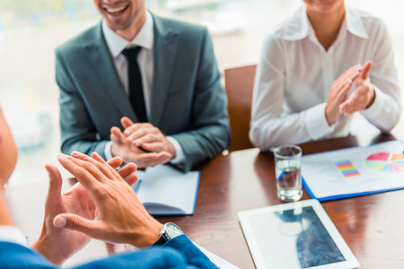 Group young business people sitting in office and holding meeting