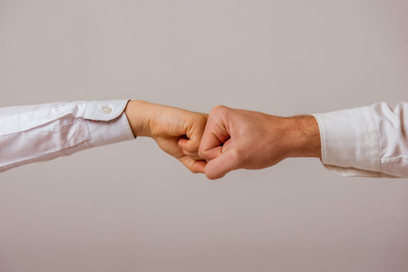 Fists of father and son bumping each otherの写真素材