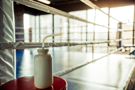 Bottle of water on a chair in the corner of the empty ring in fight club