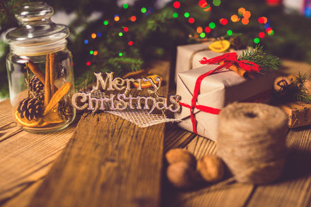 Merry Christmas! Accessories for celebrating Christmas on a wooden tableの写真素材