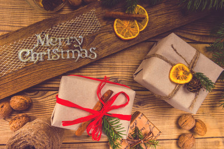 Merry Christmas! Accessories for celebrating Christmas on a wooden tableの写真素材