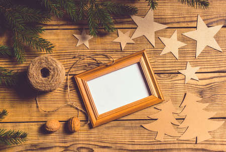 Merry Christmas! Accessories for celebrating Christmas on a wooden tableの写真素材