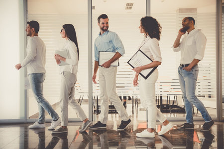 Successful business people with folders  are going to conferenceの写真素材