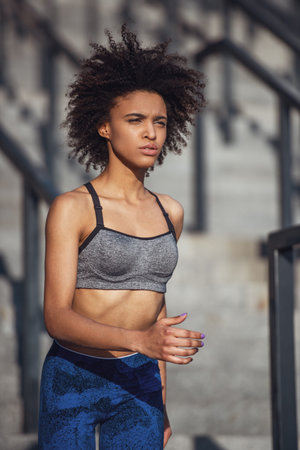 Beautiful girl in sportswear is runningの写真素材