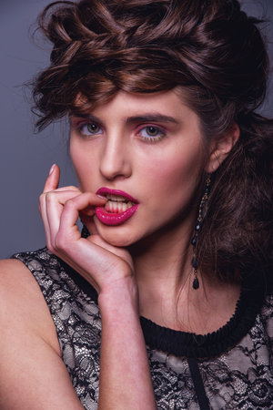 Glamour Fashion Woman Portrait. Studio shooting. Gray backgroundの写真素材