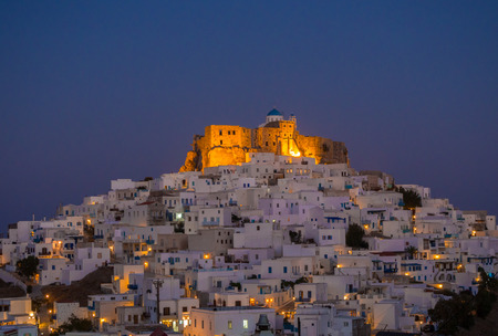 Blue hour in Astypalaia ,Greece with the lights starting to show through the narrow streetsの写真素材