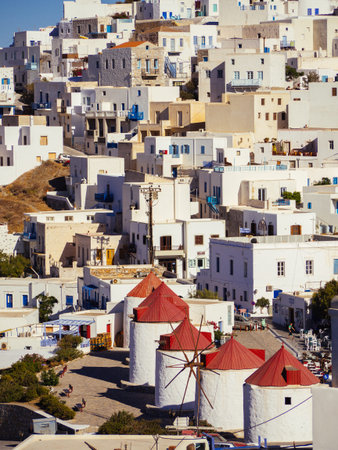 A close up of the windmills of Astypalaia with a zoom lens at daytime