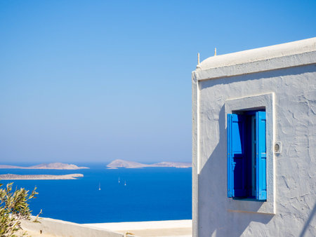 A blue traditional window looking over the aegeanの写真素材
