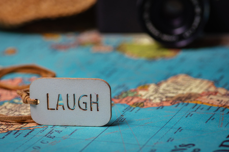 Travel concept background .A love sing on a map with a retro camera and a hat on the backgroundの写真素材