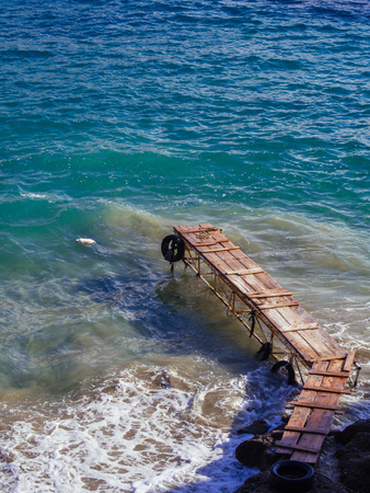 A small wooden gilt serves the small boats that reach the beach, of Psili Ammosの写真素材
