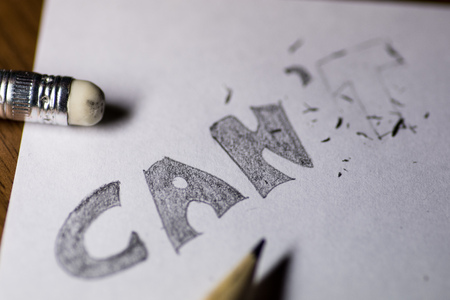 I can't, written in pencil with the t erasedの写真素材